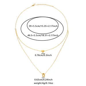 Detail view of gold double layer necklace with heart and letter D pendants and measurements