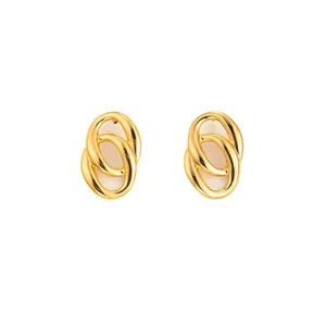 Detailed view of intertwined geometric gold hoop earrings with a polished metal finish