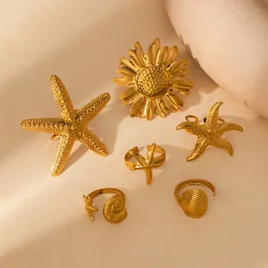 Golden starfish and sunflower stainless steel ring set with shell and pearl details