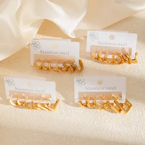 Polished gold stainless steel earring set featuring round heart and star hoop designs