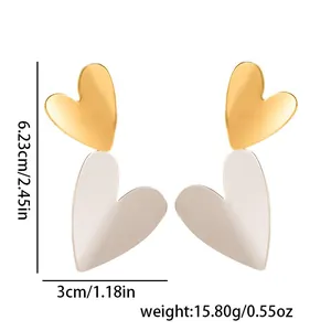 Two-tone gold and cream heart drop earrings in durable stainless steel design
