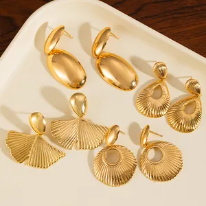Set of four gold-plated stainless steel earrings featuring oval and ginkgo leaf designs