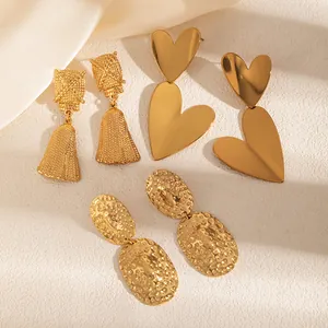 Three pairs of vintage 18k gold plated stainless steel heart and textured earrings