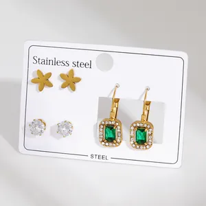 Three-pair stainless steel earring set with matte gold flowers and green gemstones