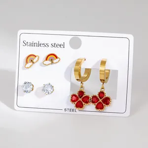 Three-pair stainless steel earring set featuring rainbow icons and heart crystal drops