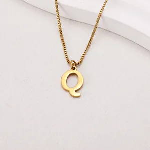 Minimalist gold plated stainless steel necklace featuring a polished letter Q pendant