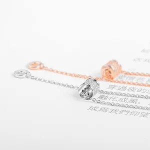 Collane con ciondolo a cilindro in argento e oro rosa con zirconi cubici scintillanti