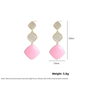 Detail showing dimensions of long cat eye stone earrings with pink enamel squares