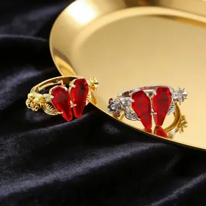 Gothic open rings with red coffin stones and rose relief in gold and silver finish