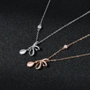 Elegant gold-plated cat eye stone bow necklace in silver and rose gold finishes