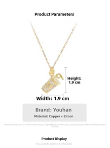 Detailed macro view of cup-shaped copper pendant with cubic zirconia on a gold chain