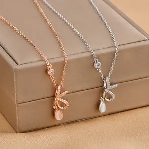 Exquisite gold plated bow necklace with teardrop opal stone in rose gold and silver
