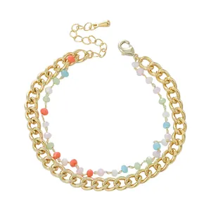 Bracciale a doppia catena dorata con perle di cristallo colorate e chiusura a moschettone