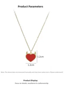 Detail of red heart pendant with gold devil horns and 1.2cm measurement info