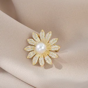 Macro detail of daisy brooch with pavé zircon petals and central white pearl on satin