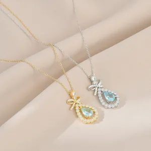 Collier Pendentif Nœud et Goutte en Cuivre avec Zirconia Plaqué Or Pierre Bleu Clair Chaîne de Clavicule Femme