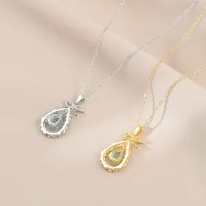 Élégants colliers plaqués or et argent avec pendentifs goutte bleue et nœuds délicats