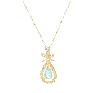 Collier doré avec pendentif nœud, pierre goutte d'eau bleue et oxydes de zirconium