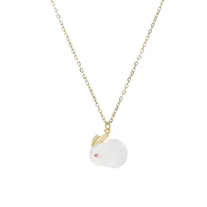 Gold plated collar necklace featuring a cute white rabbit pendant with pink crystal eyes