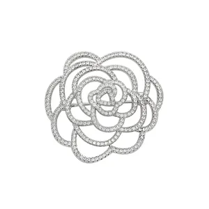 Elegant silver camellia flower brooch with hollow petals and sparkling zircon pavé