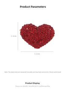 Detailed view of red crystal heart brooch with dimensions 3.2cm width and 2.4cm height