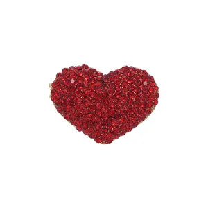 Elegant red heart brooch set with sparkling rhinestones on a gold-plated metal base