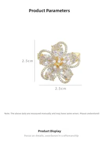 Detailed view of the 2.5cm gold-plated flower brooch with micro-set cubic zirconia