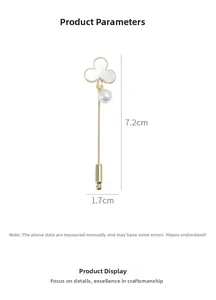 Detail of clover brooch with natural shell and pearl, measuring 7.2cm by 1.7cm in length