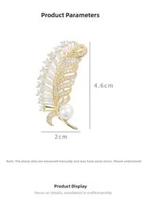 Detailed view of feather brooch with zircons and pearl, size 4.6cm by 2.0cm