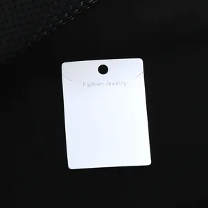 White cardstock jewelry display card with Fashion Jewelry text for earrings and necklaces