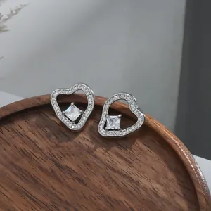 Elegant heart-shaped micro-pave zircon stud earrings with square-cut center gemstone