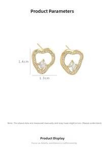 Macro shot of micro-pave heart stud earrings in gold with white zircon detailing