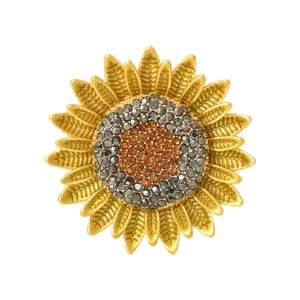 Exquisite gold-plated sunflower brooch with amber crystal petals on white background