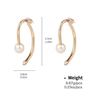 Detail view of gold earrings with pearls and rhinestones showing 3.7cm height measurements