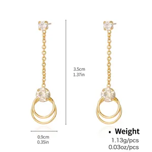 Detailed view of gold drop earrings featuring dimensions 3.5cm length and 0.9cm width