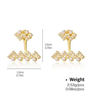 Detailed view of gold plated heart earrings with pearls and pavé cubic zirconia studs
