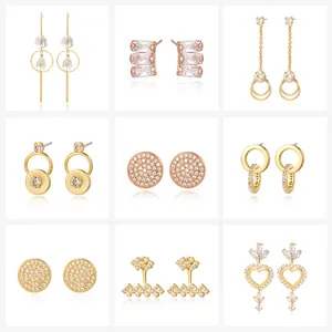 Collection of nine gold plated copper stud earrings with cubic zirconia and pearls