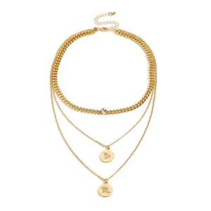 Three-layer gold necklace set with Cuban chain, zodiac pendants and sparkling crystals