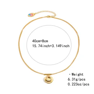 Double-layered golden necklace with round pavé diamond pendant and a butterfly tag