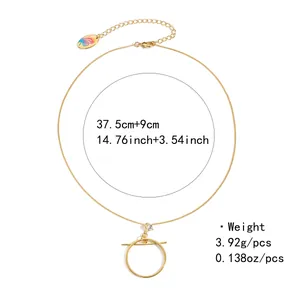 Detail of gold necklace with round pendant and size specifications in centimeters
