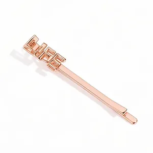 Elegant rose gold minimalist hair clip featuring a polished hollow GIRL letter design