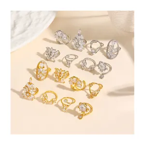 Detailed collection of gold plated copper nail rings with sparkling zircon floral accents