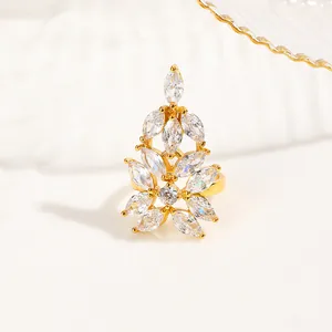 Macro shot of gold-plated nail ring featuring marquise-cut zircon floral cluster