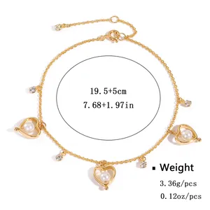 Elegant gold-tone adjustable heart bracelet with faux pearls and sparkling rhinestones