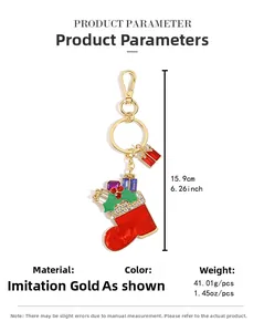 Detailed view of red Christmas stocking keychain with rhinestones and gift box charm