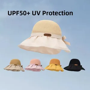 UPF50+ women's sun hat with woven top and fabric brim featuring a decorative bow tie