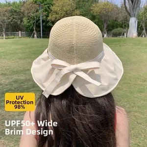 Detail view of wide brim sun hat with bow decoration and UPF 50 plus protection