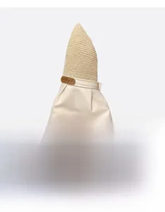 Detail of foldable beige sun hat showing portable design and soft canvas texture