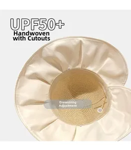 Close-up of sun hat interior showing UPF50+ label, adjustable drawstring, and woven details