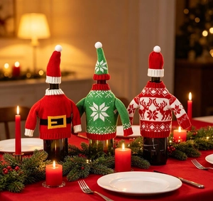 Close-up of festive Christmas knitted wine bottle sweaters and hats in a cozy dinner setting